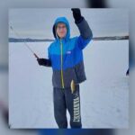 Photo of member Jacob Dunnum proudly showing the first catch of the day for the Ice-Fish-A-Thon 2021 on Lake Onalaska. Eight UW-La Crosse Sigma Tau Gamma members raised $3,610 for Special Olympics.