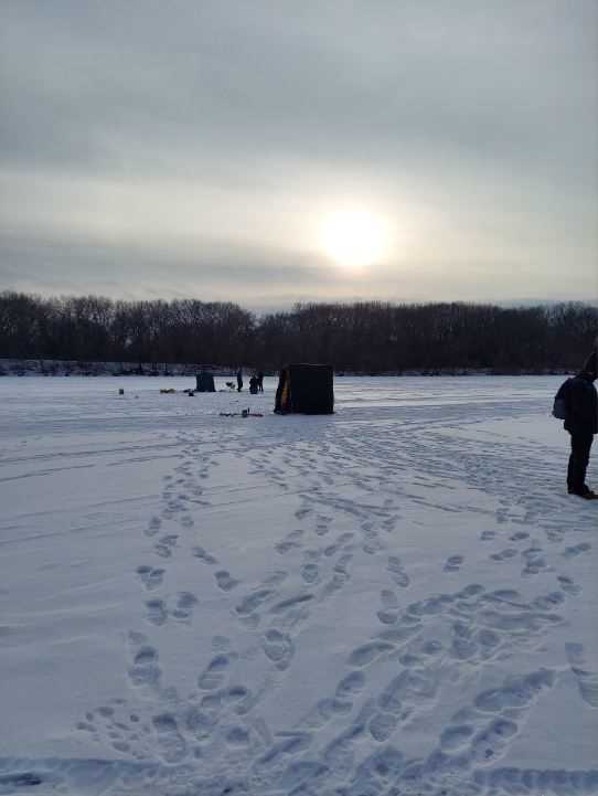 Photo of UW-La Crosse Sigma Tau Gamma’s socially distanced ice fishing shanties on Lake Onalaska.