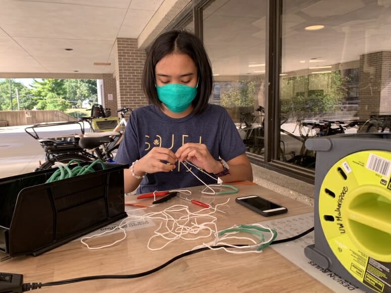 Photo of early fall 2020, when College of Engineering student employees assembled Badger Seal mask fitters outside the Grainger Engineering Design Innovation Laboratory in Wendt Commons. RENEE MEILLER, UW–MADISON COLLEGE OF ENGINEERING