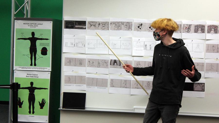 Photo of student Joe Leider discussing ideas in the Animation Production class. / UW-Stout photo