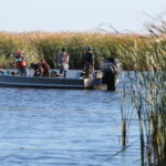 Photo of UW-Green Bay estuarine researchers on a boat