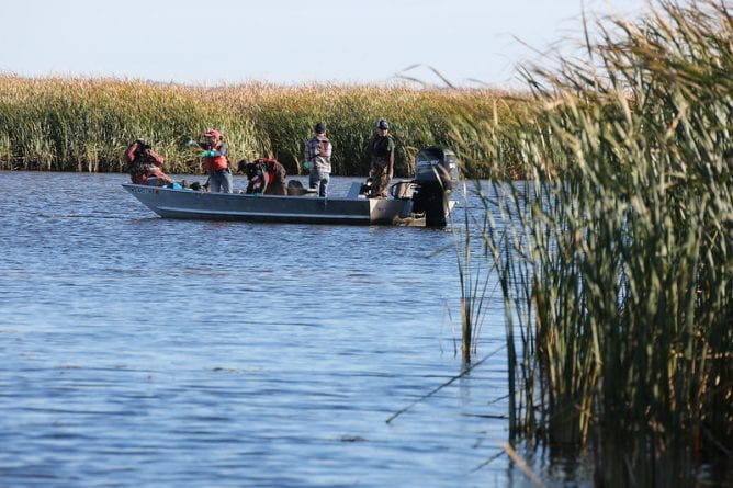 Photo of UW-Green Bay estuarine researchers on a boat