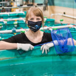 Photo of Emma Kraco, who worked in aquaculture for several years before deciding to go to college. UWM's Freshwater Sciences program attracted her to the university. (UWM Photo/Elora Hennessey)
