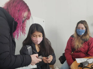 Photo of UW-Eau Claire students (from left) Claire Ganschow, Wendy Villalva, and Alexis Polencheck, who visited farms and other locations to interview Spanish-speaking people about their experiences during the pandemic. (Submitted photo)