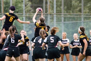 Photo of Roberts catching a line out while playing rugby for the Titans.