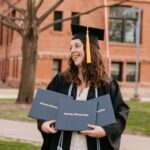 Photo of Abi Gardiner, of DeForest, who plans to put her three diplomas from UW-Stout to good use in her wedding and portrait photography business in the Twin Cities. / Photo by Abigail Ann Photography