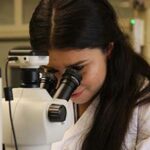 Photo of Daniela Leon Vargas conducting research on marine microplastics.