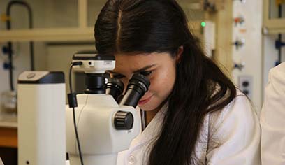 Photo of Daniela Leon Vargas conducting research on marine microplastics.