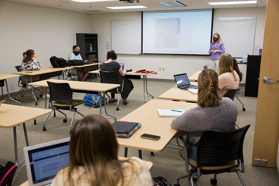 Photo of UW-Whitewater Professor of Psychology Christine Neddenriep lecturing in class with a cohort of school psychology graduate students on April 27, 2021.