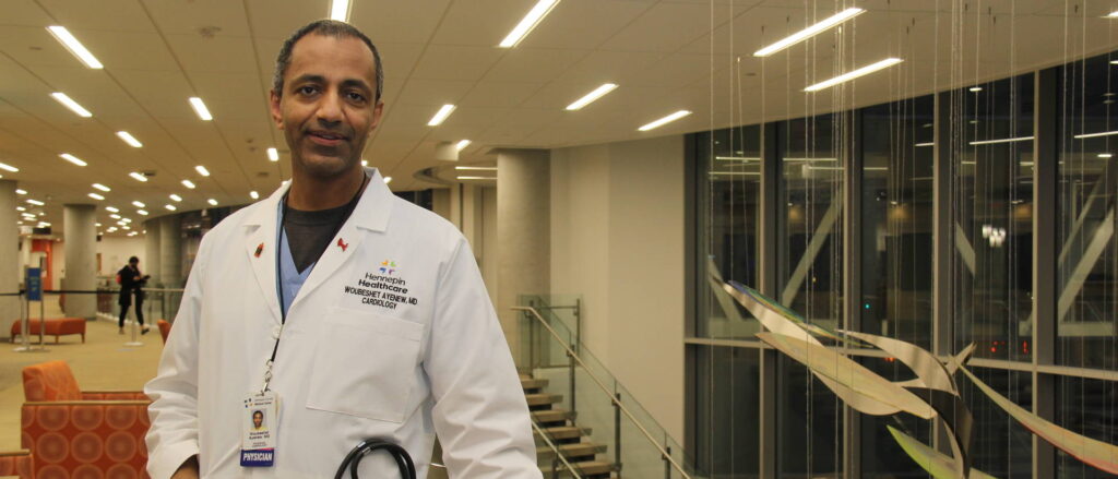 Photo of Dr. Woubeshet Ayenew, who was still in his medical residency when he found his calling, providing care to underserved populations in Minneapolis. Nearly 20 years later, he’s a respected cardiologist and community advocate in the Twin Cities, providing care while also trying to increase the number of African American physicians.