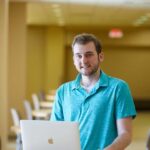 Photo of UW-La Crosse senior Kaelan Engholdt, who with the help of Assistant Professor David Mathias, has created an "extinction event" operator that allows computers to more effectively solve complex problems.