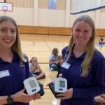 Photo of UW-Stevens Point health promotion and wellness students working with the Nekoosa School District on blood pressure screening, one of the partnerships that will be enhanced with a $3 million gift from the Legacy Foundation of Central Wisconsin.