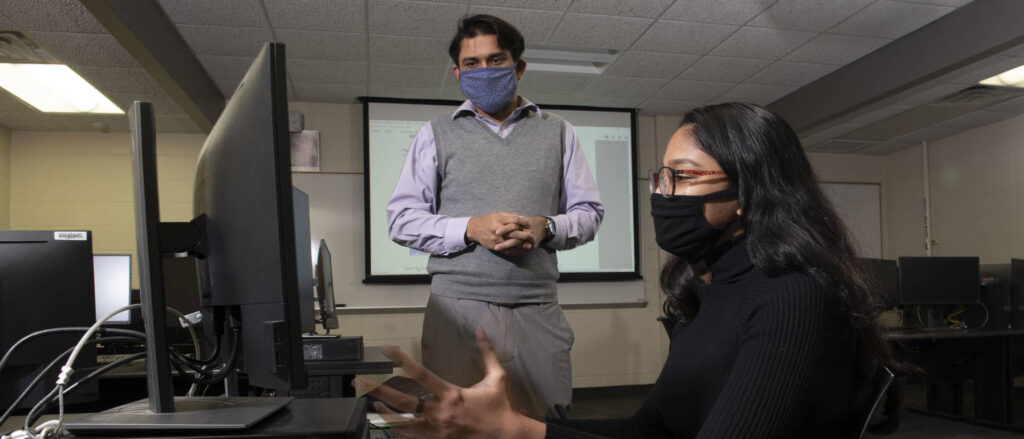 Photo of Avi Devy Mohan, who has had multiple research experiences as a Blugold after transferring to UW-Eau Claire from a university in Malaysia. A computer science and mathematics major, Mohan has worked alongside faculty research mentors from three academic areas on campus as well as with physicians at Mayo Clinic Health System. (Photo by Bill Hoepner)