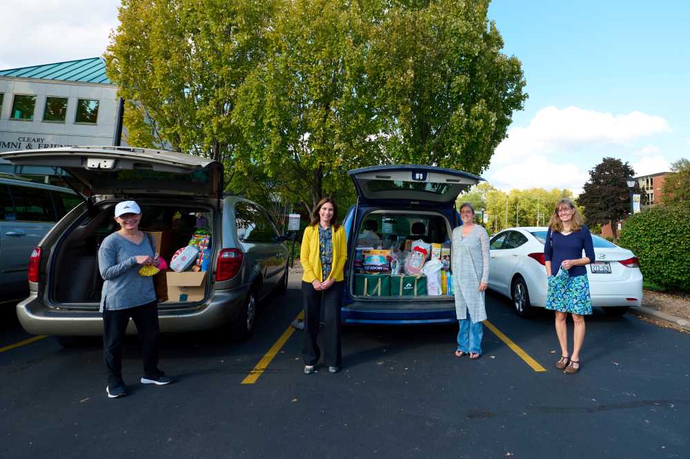 Photo of (from left): Peg Maher, Lisa Klein, Sarah Mosley and Susan Kelly posing with toys collected on campus. They were among the UWL faculty and staff who led efforts on campus to collect toys for children Afghan refugees at Fort McCoy.