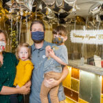 Photo of Ryan Rupp, who attended the Children’s Learning Center as a child and now, his children are there. Rupp is pictured at the 50th anniversary celebration with his wife, Brenda Hasse-Rupp, and their two children, Arthur and Margot. (UWM Photo/Elora Hennessey)