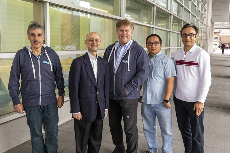 Photo of UW-Milwaukee researchers who contributed to the paper, including Peter Schwander (from left), Abbas Ourmazd, Marius Schmidt, Russell Fung and Ahmad Hosseinizadeh, who is the first author. (UWM Photo/Troye Fox)