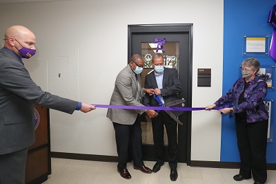 Photo of ​Joshua Hagen, dean of the College of Letters and Science; Chancellor Thomas Gibson; Ray Ackerlund, president of Skyward; and Cindy McCabe, head of the Department of Mathematical Sciences, helping to open the new Skyward Internship Center at UW-Stevens Point.