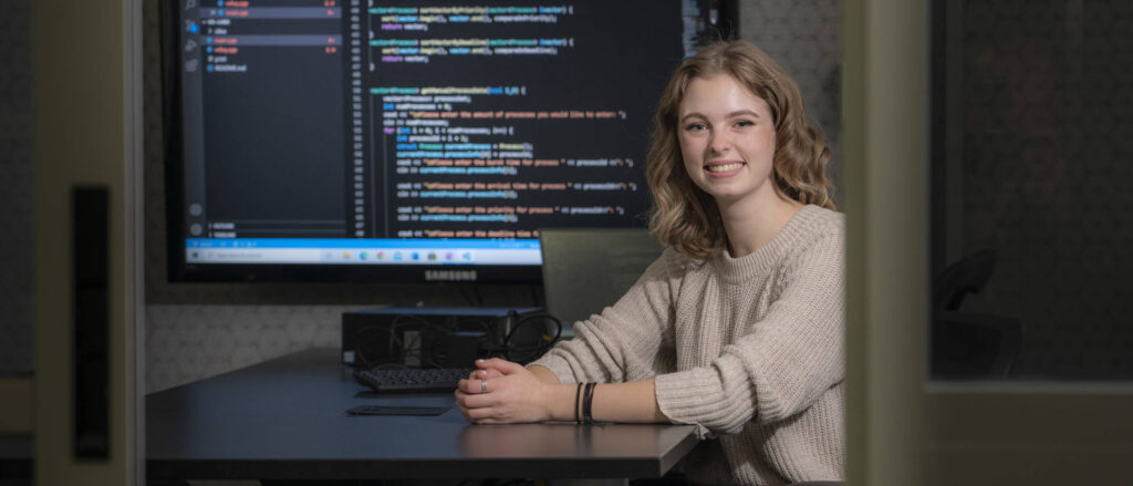 Photo of Alexis Lappe, who has excelled in the classroom as a UW-Eau Claire computer science major, but she also worked hard as a Blugold to make the STEM fields more inclusive and equitable. After she graduates in December, she plans to continue her efforts to bring more women and minorities into computer science and related fields. (Photo by Shane Opatz)