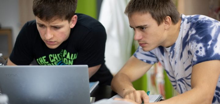 Photo of UW-Green Bay students working at a computer