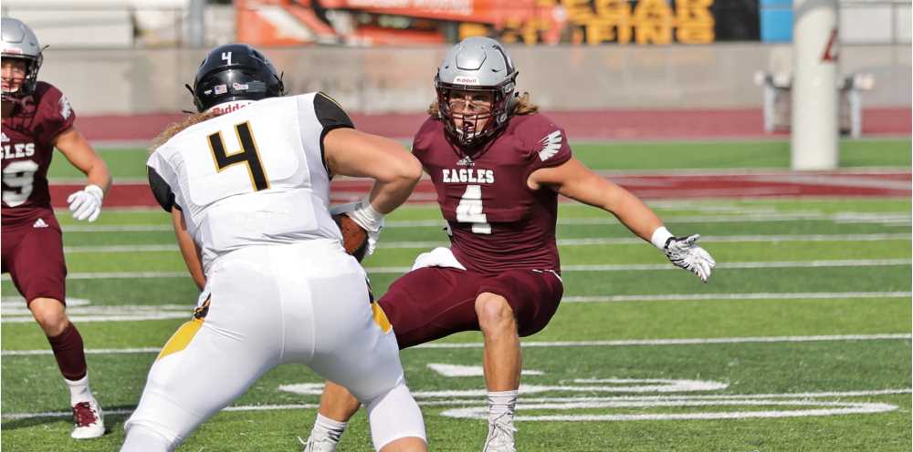 Photo of Murphy playing football. He has been an outstanding contributor for the Eagles, earning All-WIAC First Team honors in 2019. CREDIT: Jim Garvey