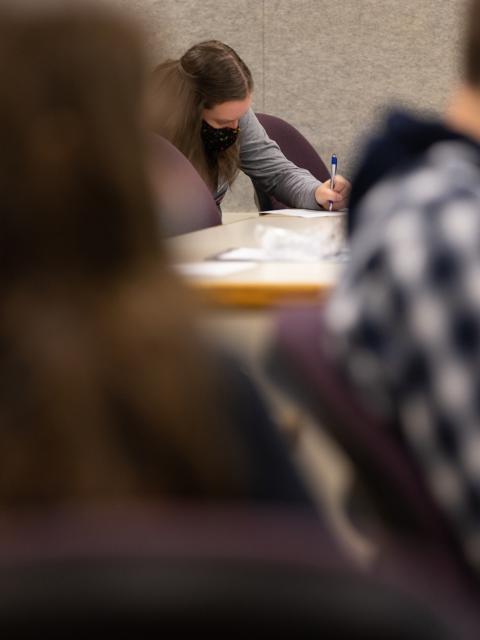 Photo of students learning how to create a lesson plan they could take back to their school and then teach. / UW-Stout photo by Chris Cooper