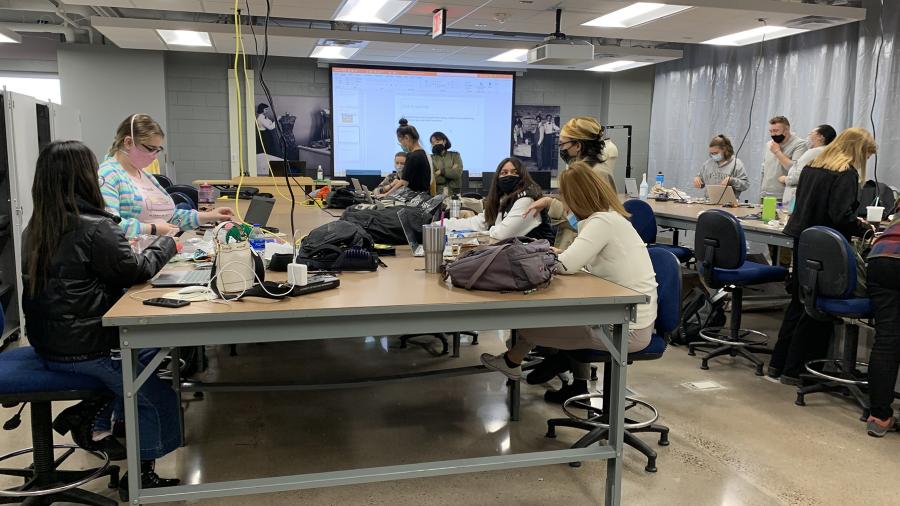 Photo of students in a fashion and retail class working recently in the new Makers Laboratory in Fryklund Hall. / UW-Stout