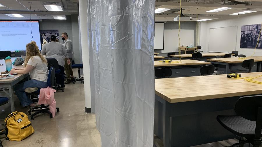 Photo of a movable curtain that divides space in the new Makers Laboratory, with an engineering and technology lab on the right. / UW-Stout