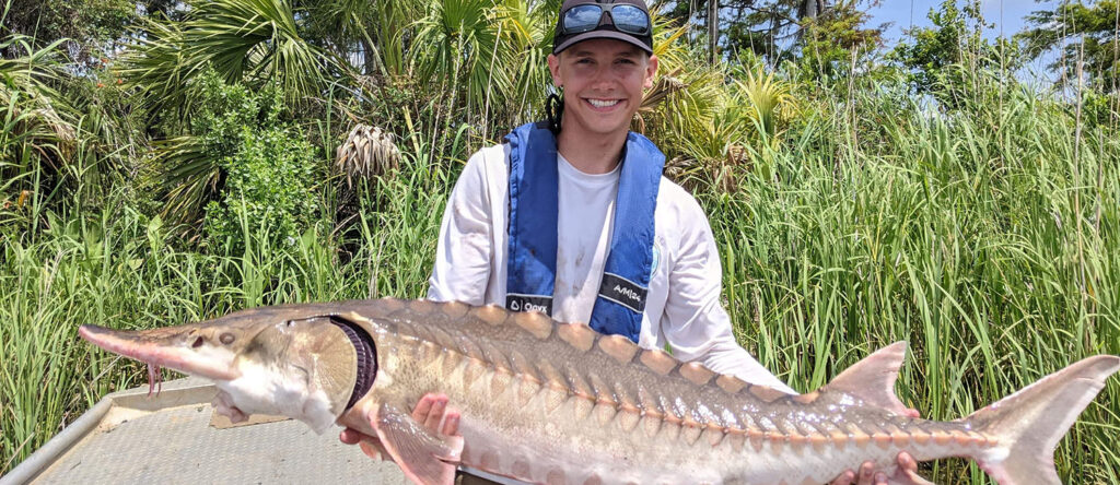 Photo of Austin Draper, whose love of fish led him to a career in water sciences.