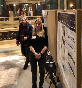 Photo of Elizabeth Johnson presenting her findings at Research in the Rotunda in March 2020.