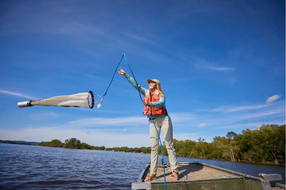 Photo of student on river: UWL students and faculty will soon head out on the Upper Mississippi River in a new vessel. The Prairie Springs: Paul Fleckenstein Trust has funded a state-of-the-art vessel equipped to expand research in the river while training the next generation of water professionals in science, technology, engineering and math.