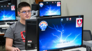 Photo of UW Oshkosh student working at computer