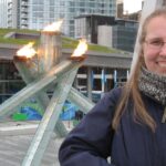 Photo of Heike Alberts with the Olympic flame at the Vancouver Paralympics in 2010.