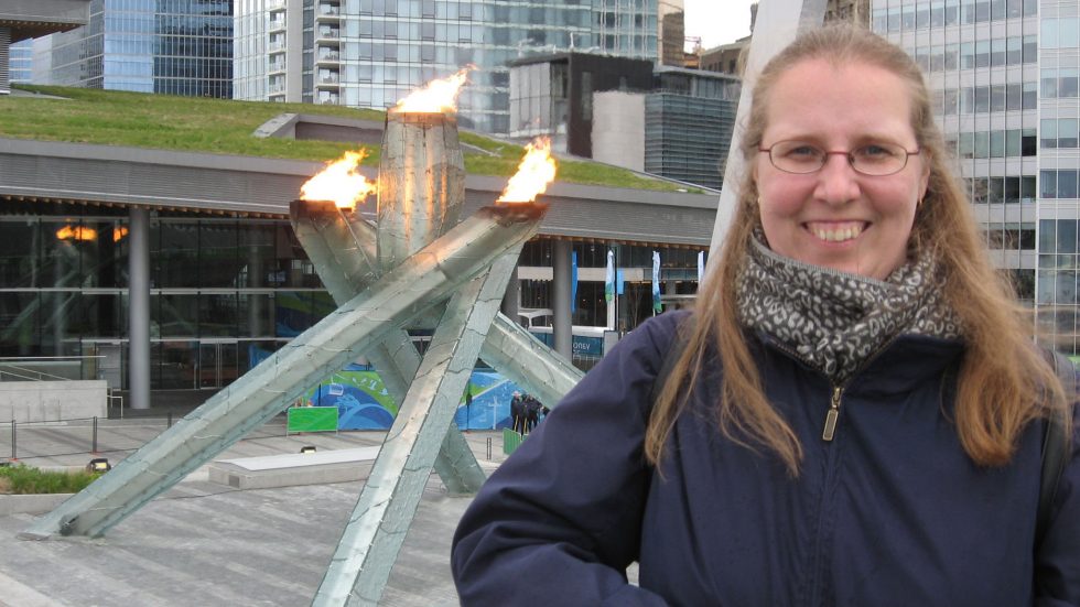 Photo of Heike Alberts with the Olympic flame at the Vancouver Paralympics in 2010.