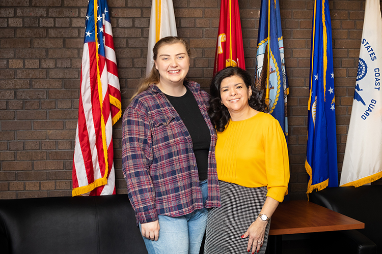 Photo of student veterans at UW-Milwaukee: “UWM has changed my life,” says Autumn Carroll (left), who came to the university after serving in the military as an Army combat medic in Kuwait and Iraq. She says the Military and Veterans Resource Center, run by Yolanda Medina (right), helped her find her way. (UWM Photo/Elora Hennessey)