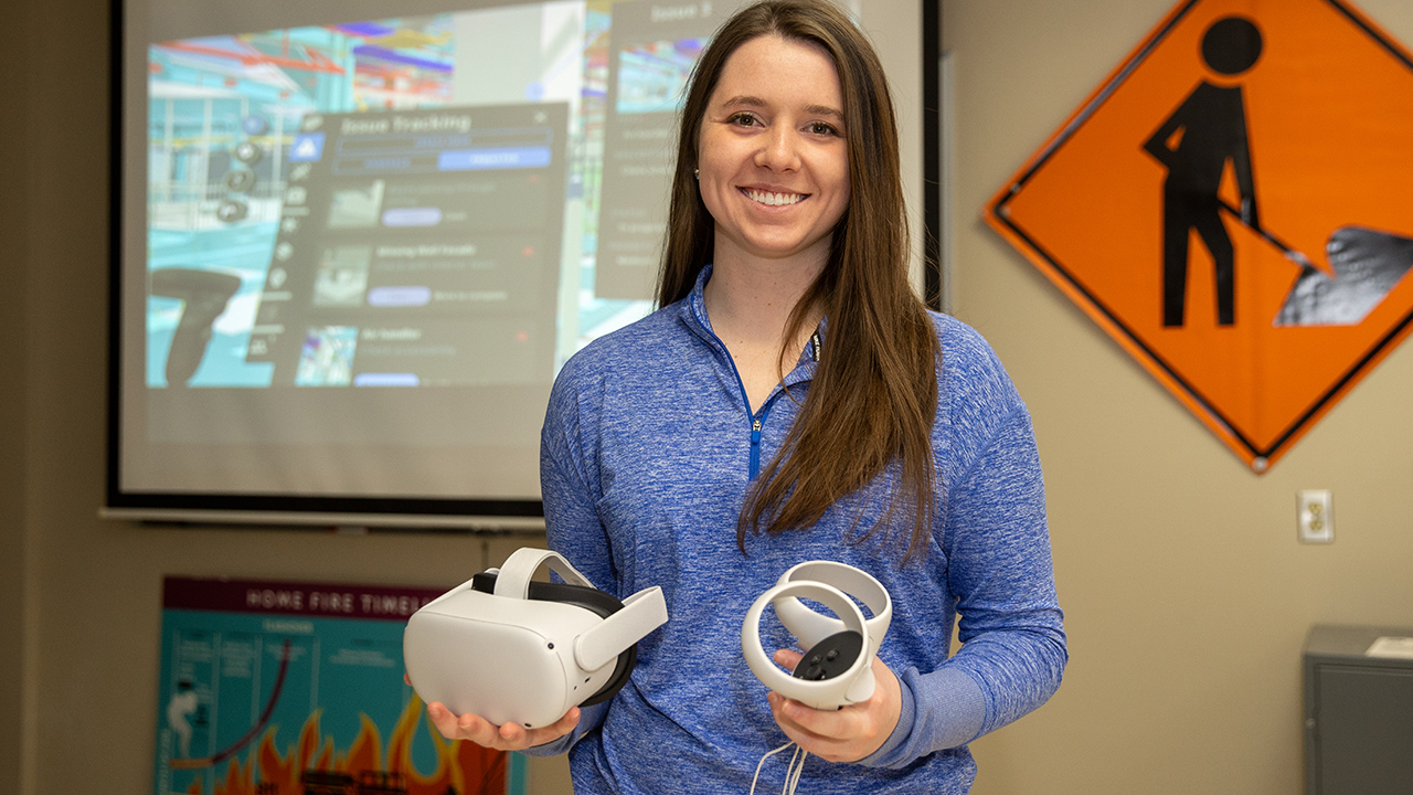 University of Wisconsin-Platteville senior Allison Stencil holding virtual reality goggles