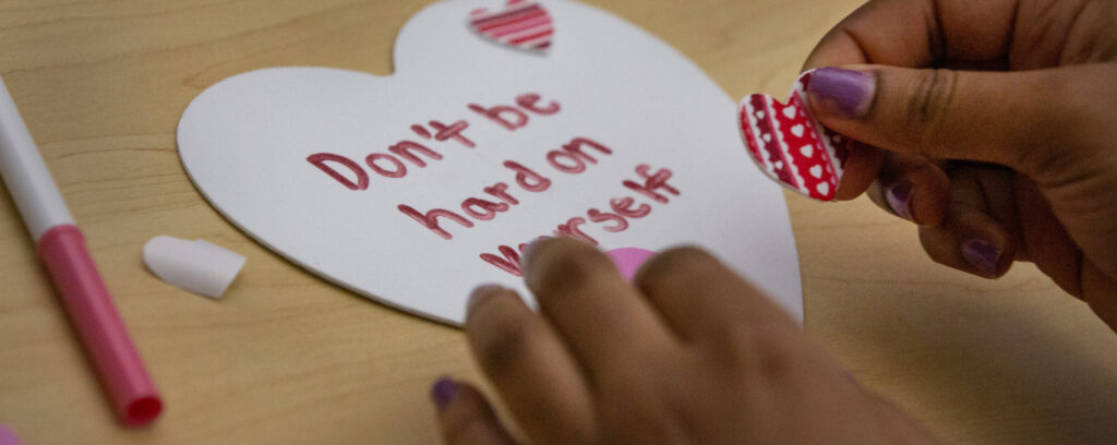 Photo of message on heart: "Don't be hard on yourself"