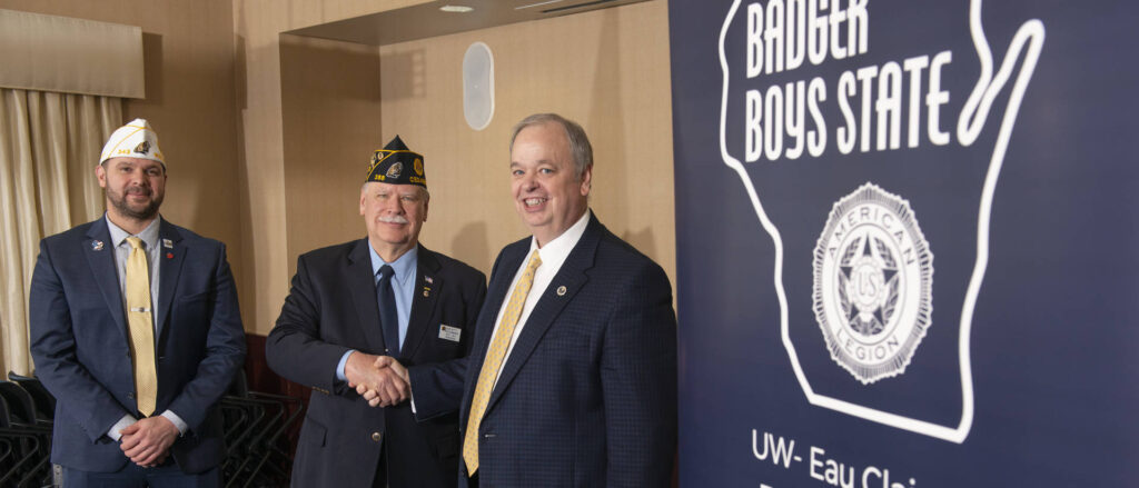 Photo of (from left) Nathan Gear of the American Legion of Wisconsin, Robert Batty of Badger Boys State, and Chancellor James Schmidt, who officially signed the memorandum of understanding for the campus to host the youth leadership program for the next three years. (Photo by Shane Opatz)