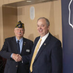 Photo of (from left) Nathan Gear of the American Legion of Wisconsin, Robert Batty of Badger Boys State, and Chancellor James Schmidt, who officially signed the memorandum of understanding for the campus to host the youth leadership program for the next three years. (Photo by Shane Opatz)