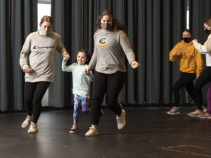 Photo of six-year-old Scarlett Prock (center), who loves her dance class and spending time with the Blugolds.