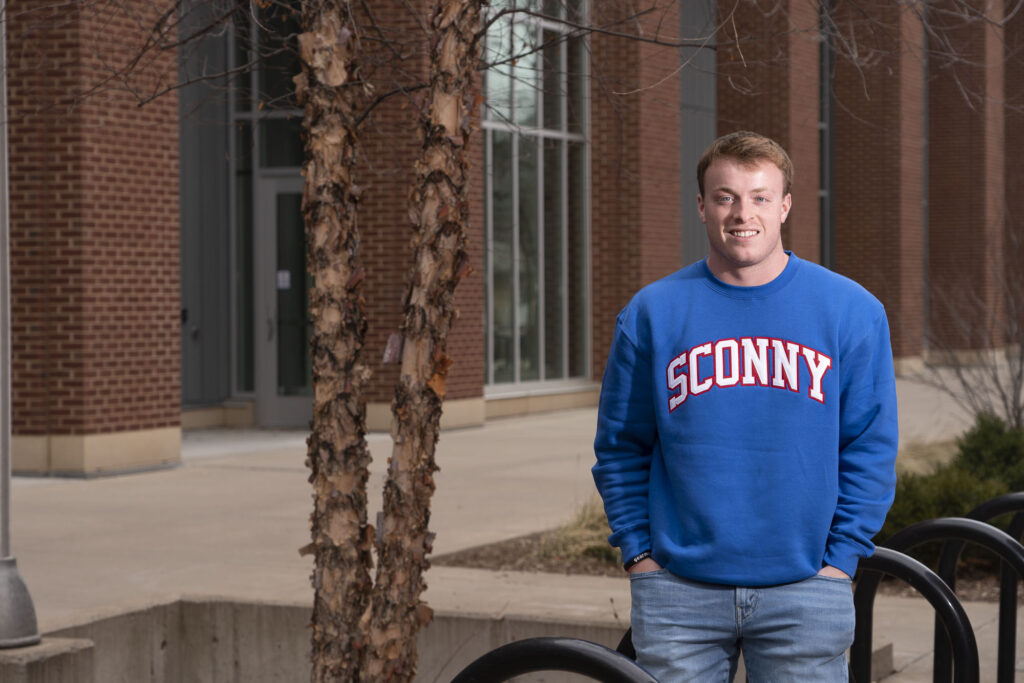 Photo of Blugold Ethan Van Grunsven, who brought his love for business and his home state of Wisconsin together to launch the apparel company Sconny Co. The business student creates and sells apparel for people who are proud to be from Wisconsin. (Photo by Bill Hoepner)