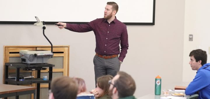 Photo of Prof. Aaron Weinschenk leading a classroom discussion