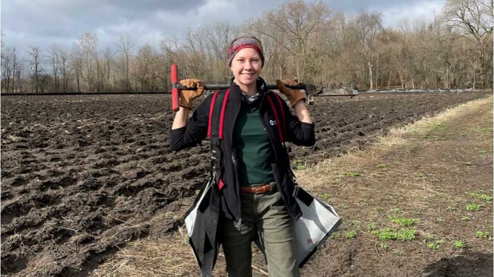 Photo of Taylor Prill, '20, who is restoring a retired, three-acre hayfield near her hometown of Clintonville, Wisconsin, into native prairie. “I am very passionate about the restoration of native environments and am thrilled to be involved in a project like this,” she says.