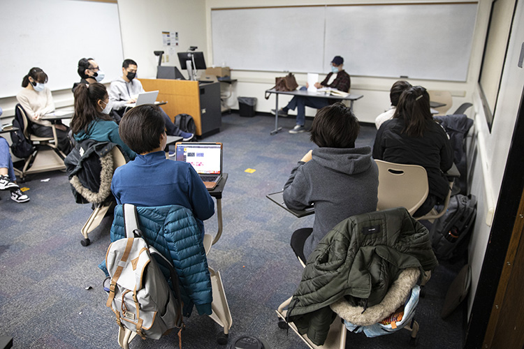 Photo by Afghan students Tahera and Farzana (center, in blue top and gray sweatshirt) listening during a writing class taught by Mark Sondrol, senior lecturer in the English Language Academy at UWM. (UWM Photo/Troye Fox)