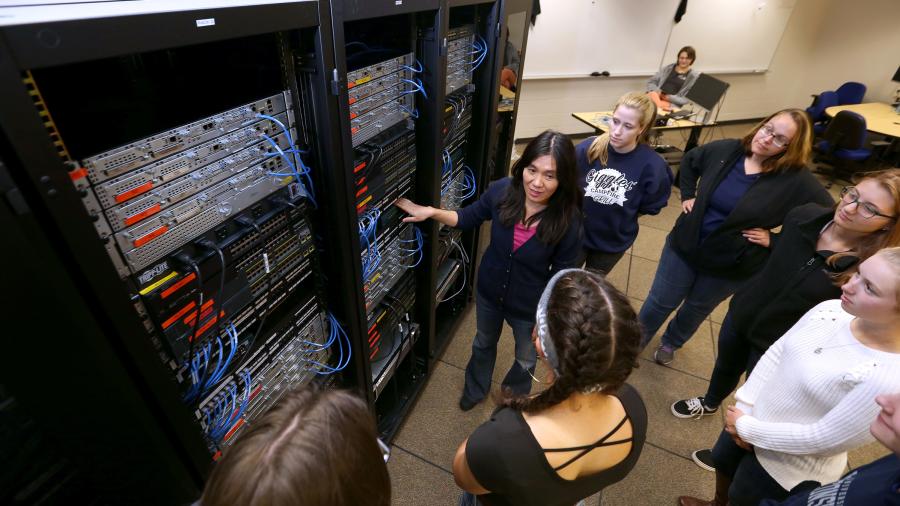 Photo of Professor Holly Yuan instructing students in a computer networking lab at UW-Stout. / UW-Stout