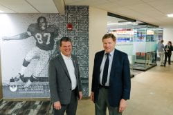 Photo of (from left) Dean Matt Dornbush posing with Green Bay Packers’ President/CEO Mark Murphy near the Willie D. Davis Finance and Investment Laboratory on the Green Bay before the start of the Ignite the Future Campaign kick off event, May 2, 2022. UW-Green Bay, Sue Pischke University Photographer