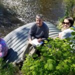 Photo of (from left) intern Heidi Lieffort, CLRR Director Bill James and CLRR Manager Mai Lia Vang sampling water from Horse Creek, which flows into Cedar Lake in Polk County. / UW-Stout