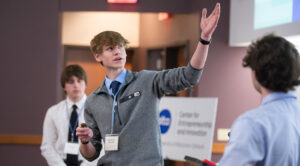 Photo of a Wisconsin high school team facing off in business model pitch contest at UW Oshkosh