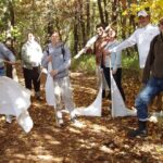 Photo of UWSP biology professor and researcher Diane Caporale collecting ticks with students in her molecular biology course