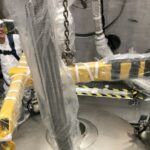 Photo of Jeff Cherwinka of the UW–Madison Physical Sciences Lab coordinating the xenon cryostat head installation. PHOTO BY DEREK LUCERO