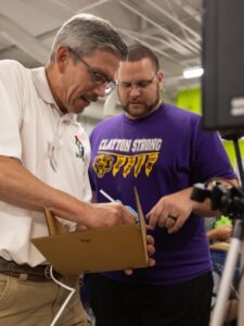 Photo of Fab Lab instructor Laurence Charlier works with a teacher from Clayton during the 2021 WiFab West workshop. / UW-Stout